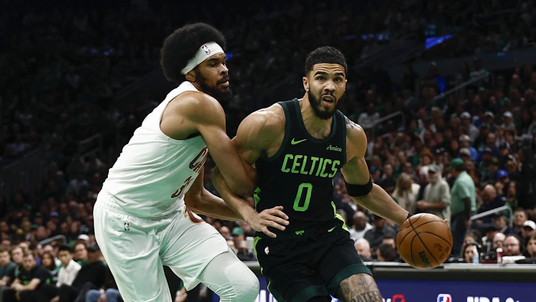 Feb 28, 2025; Boston, Massachusetts, USA; Cleveland Cavaliers center Jarrett Allen (31) tries to hold up Boston Celtics forward Jayson Tatum (0) during the first quarter at TD Garden. Mandatory Credit: Winslow Townson-Imagn Images