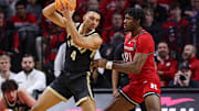 Purdue Boilermakers forward Trey Kaufman-Renn is guarded by Rutgers Scarlet Knights center Emmanuel Ogbole