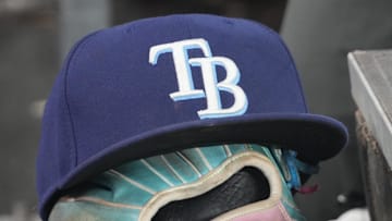 Sep 26, 2025; Toronto, Ontario, CAN; The hat and glove of Tampa Bay Rays third baseman Junior Caminero (13) in the dugout during the game against the Toronto Blue Jays at Rogers Centre. 