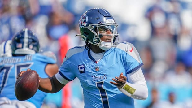 Tennessee Titans quarterback Cam Ward looks for a receiver through the Indianapolis Colts defense
