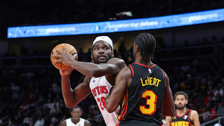 Feb 23, 2025; Atlanta, Georgia, USA; Atlanta Hawks guard Caris LeVert (3) plays defense against Detroit Pistons center Isaiah Stewart (28) during the first quarter at State Farm Arena. Mandatory Credit: Jordan Godfree-Imagn Images