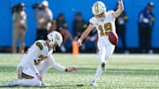 Nov 9, 2025; Charlotte, North Carolina, USA; New Orleans Saints place kicker Blake Grupe (19) kicks a field goal during the second quarter against the Carolina Panthers at Bank of America Stadium. Mandatory Credit: Jim Dedmon-Imagn Images