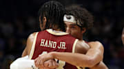 Mar 8, 2025; Pittsburgh, Pennsylvania, USA;  Boston College Eagles guard Dion Brown (1) and guard Dion Brown (right) embrace as time runs out against the Pittsburgh Panthers at the Petersen Events Center. Mandatory Credit: Charles LeClaire-Imagn Images