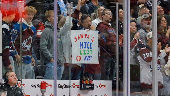 Dec 11, 2025; Denver, Colorado, USA; A Colorado Avalanche fan holds up a sign in the first period against the Florida Panthers at Ball Arena. Mandatory Credit: Isaiah J. Downing-Imagn Images