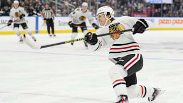 Dec 2, 2024; Toronto, Ontario, CAN; Chicago Blackhawks forward Connor Bedard (98) shoots the puck against the Toronto Maple Leafs during the second period at Scotiabank Arena. Mandatory Credit: John E. Sokolowski-Imagn Images
