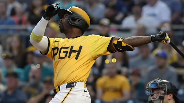 Aug 16, 2024; Pittsburgh, Pennsylvania, USA;  Pittsburgh Pirates designated hitter Andrew McCutchen (22) drives in a run with a sacrifice fly against the Seattle Mariners during the fifth inning at PNC Park.