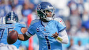 Tennessee Titans quarterback Cam Ward (1) looks for a receiver through the Indianapolis Colts defense during the fourth quarter at Nissan Stadium in Nashville, Tenn., Sunday, Sept. 21, 2025.
