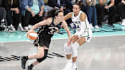 New York Liberty forward Breanna Stewart looks to drive past Minnesota Lynx forward Napheesa Collier during Game 2 of the 2024 WNBA Finals.