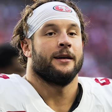 Jan 5, 2025; Glendale, Arizona, USA; San Francisco 49ers defensive end Nick Bosa (97) against the Arizona Cardinals at State Farm Stadium. Mandatory Credit: Mark J. Rebilas-Imagn Images