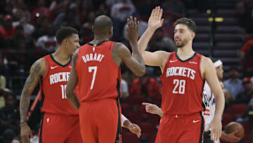 Nov 16, 2025; Houston, Texas, USA; Houston Rockets center Alperen Sengun (28) and forward Kevin Durant (7) celebrate after a play during the second quarter against the Orlando Magic at Toyota Center. Mandatory Credit: Troy Taormina-Imagn Images