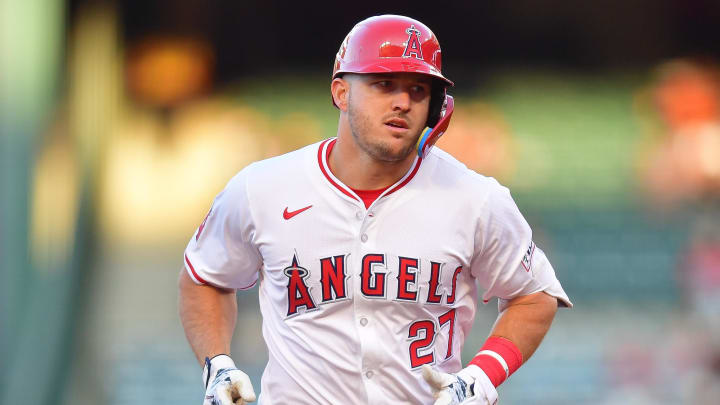 Apr 23, 2024; Anaheim, California, USA; Los Angeles Angels center fielder Mike Trout (27) rounds the bases after hitting a solo home run against the Baltimore Orioles during the first inning at Angel Stadium. 