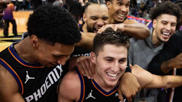 Nov 21, 2025; Phoenix, Arizona, USA; Phoenix Suns guard Collin Gillespie (12) celebrates with teammates after hitting the game winning shot against the Minnesota Timberwolves in the second half of an NBA Cup game at Mortgage Matchup Center. Mandatory Credit: Mark J. Rebilas-Imagn Images