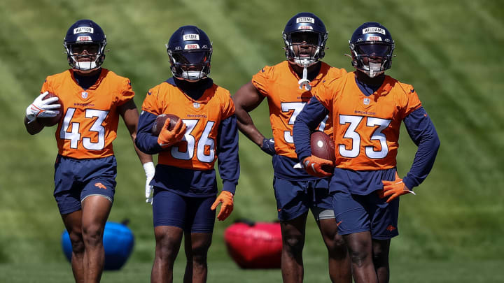 Javonte Williams (33) takes OTA reps at Denver Broncos HQ with hsi fellow running backs. 