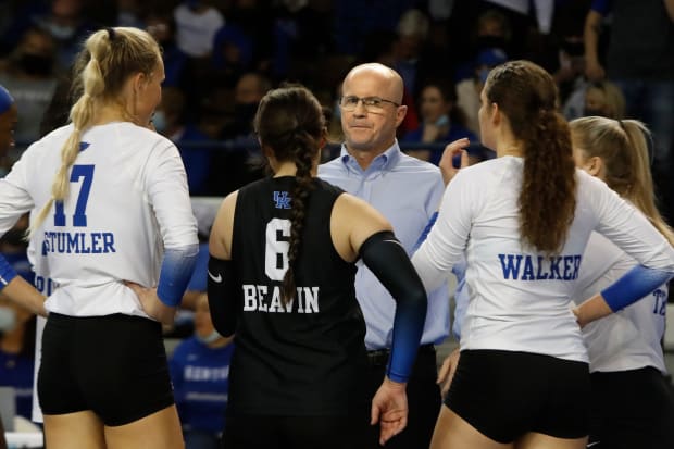 Kentucky Volleyball Head Coach Craig Skinner talks to his team during a timeout against Illinois.