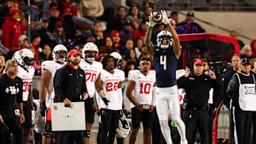 Nov 15, 2024; Tucson, Arizona, USA; Arizona Wildcats wide receiver Tetairoa McMillan (4) catches the ball during the third quarter against the Houston Cougars at Arizona Stadium. Mandatory Credit: Aryanna Frank-Imagn Images