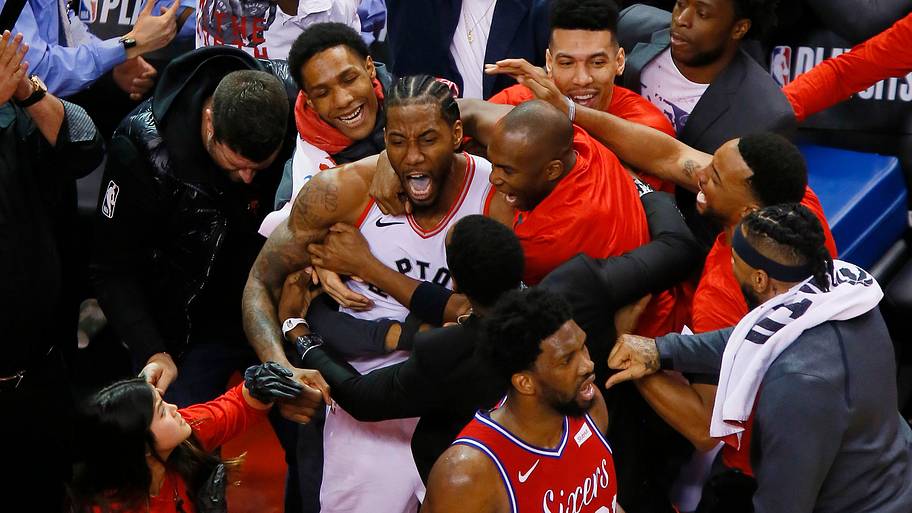 Kawhi Leonard and the Raptors celebrate his series-clinching shot.