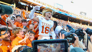 Oct 12, 2024; Dallas, Texas, USA;  Texas Longhorns defensive back Michael Taaffe (16) celebrates with fans after the game against the Oklahoma Sooners at the Cotton Bowl.