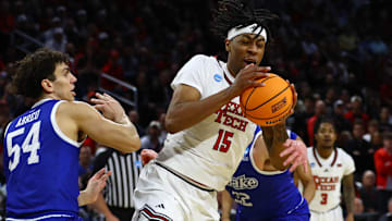 Mar 22, 2025; Wichita, KS, USA; Texas Tech Red Raiders forward JT Toppin (15) controls the ball against Drake Bulldogs forward Daniel Abreu (54) during the first half at Intrust Bank Arena. Mandatory Credit: Nick Tre. Smith-Imagn Images