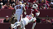 Sep 21, 2025; Santa Clara, California, USA; Arizona Cardinals quarterback Kyler Murray (1) is tackled by San Francisco 49ers defensive end Mykel Williams (98) during the second half at Levi's Stadium. Mandatory Credit: Kyle Terada-Imagn Images