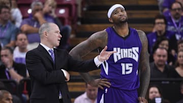October 29, 2014; Sacramento, CA, USA; Sacramento Kings head coach Michael Malone (left) instructs center DeMarcus Cousins (15) during the fourth quarter against the Golden State Warriors at Sleep Train Arena. The Warriors defeated the Kings 95-77. Mandatory Credit: Kyle Terada-Imagn Images