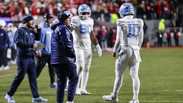 Nov 29, 2025; Raleigh, North Carolina, USA; North Carolina Tar Heels head coach Bill Belichick on the sideline during the second half of the game against NC State Wolfpack at Carter-Finley Stadium.  Mandatory Credit: Jaylynn Nash-Imagn Images
