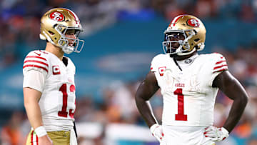 San Francisco 49ers quarterback Brock Purdy (L) and wide receiver Deebo Samuel (R)