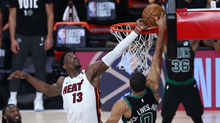 Sep 15, 2020; Lake Buena Vista, Florida, USA; Miami Heat forward Bam Adebayo (13) blocks a shot by Boston Celtics forward Jayson Tatum (0) during overtime in game one of the Eastern Conference Finals of the 2020 NBA Playoffs at ESPN Wide World of Sports Complex. Mandatory Credit: Kim Klement-Imagn Images