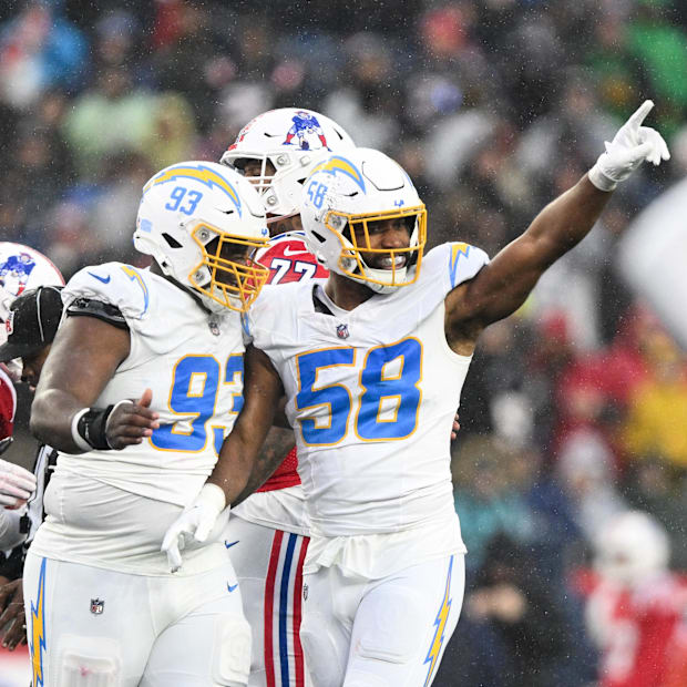 Justin Hollins (58) reacts