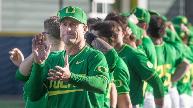 Oregon baseball coach Mark Wasikowski joins his team before their home opener against the Lafayette Leopards at PK Park in Eu