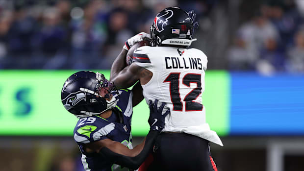 Oct 20, 2025; Seattle, Washington, USA; Houston Texans wide receiver Nico Collins (12) catches a pass against Seattle Seahawk