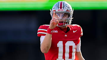 Ohio State Buckeyes quarterback Julian Sayin (10) motions for a first down during the NCAA football game against the Rutgers Scarlet Knights at Ohio Stadium in Columbus on Nov. 22, 2025. Ohio State won 42-9.