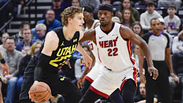 Dec 31, 2022; Salt Lake City, Utah, USA; Miami Heat forward Jimmy Butler (22) defends Utah Jazz forward/center Lauri Markkanen (23) during the first half at Vivint Arena. Mandatory Credit: Christopher Creveling-Imagn Images