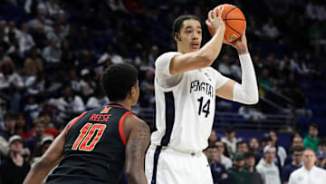 Penn State Nittany Lions forward Yanic Konan Niederhauser (14) looks to pass the ball as Maryland Terrapins forward Julian Reese (10) defends during the first half at Bryce Jordan Center. 