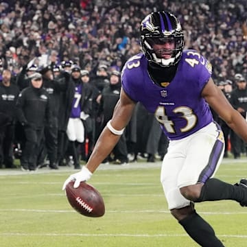Baltimore Ravens running back Justice Hill scores a touchdown against the Pittsburgh Steelers.