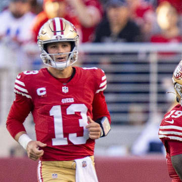 San Francisco 49ers wide receiver Deebo Samuel runs after a pass from quarterback Brock Purdy.