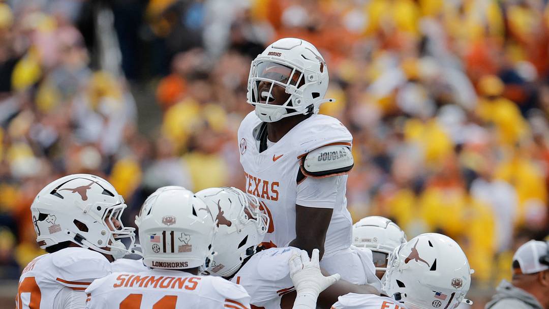Texas Longhorns defensive back Derek Williams Jr. celebrates with teammates after making an interception Texas Longhorns defensive back Derek Williams Jr. celebrates with teammates after making an interception