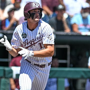 Jun 23, 2024; Omaha, NE, USA;  Texas A&M Aggies right fielder Jace Laviolette (17) hits a home run against the Tennessee Volunteers during the first inning at Charles Schwab Field Omaha. Mandatory Credit: Steven Branscombe-Imagn Images