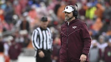 Dec 27, 2023; Annapolis, MD, USA;  Virginia Tech Hokies head coach Brent Pry walks onto the field during the first half against the Tulane Green Wave at Navy-Marine Corps Memorial Stadium. Mandatory Credit: Tommy Gilligan-Imagn Images