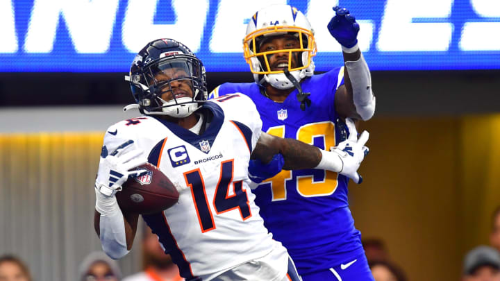 Dec 10, 2023; Inglewood, California, USA;  Denver Broncos wide receiver Courtland Sutton (14) catches a touchdown pass against Los Angeles Chargers cornerback Michael Davis (43) during the second half at SoFi Stadium. Mandatory Credit: Gary A. Vasquez-USA TODAY Sports