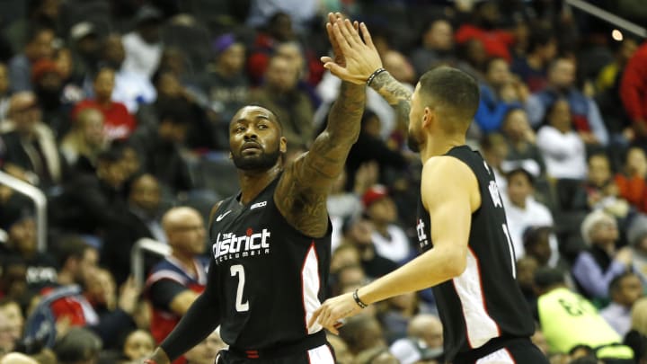 Nov 24, 2018; Washington, DC, USA; Washington Wizards guard John Wall (2) celebrates with Wizards guard Austin Rivers (1) against the New Orleans Pelicans in the fourth quarter at Capital One Arena. 