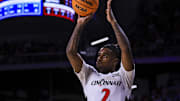 Feb 8, 2025; Cincinnati, Ohio, USA; Cincinnati Bearcats guard Jizzle James (2) shoots against the Brigham Young Cougars in the first half at Fifth Third Arena. Mandatory Credit: Katie Stratman-Imagn Images
