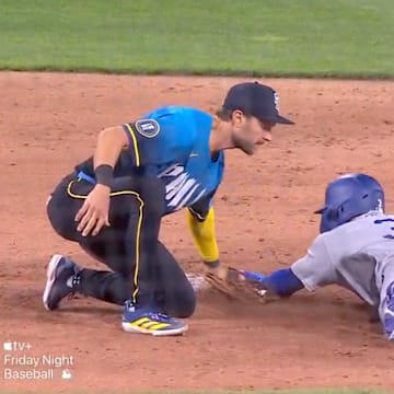 Philadelphia Phillies shortstop Trea Turner tags Los Angeles Dodgers pinch runner Chris Taylor out at second base.