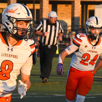 Sophomore Dalton Loguidice (8) runs the ball for the Liverpool Legends in a game against Corning on Sept. 12.