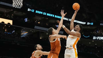 March 23, 2024, Charlotte, NC; Tennessee Volunteers forward Tobe Awaka (11) shoots over Texas Longhorns forward Kadin Shedrick (5).