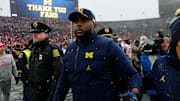 Michigan Wolverines head coach Sherrone Moore leaves the field following the NCAA football game against the Ohio State Buckeyes at Michigan Stadium in Ann Arbor.