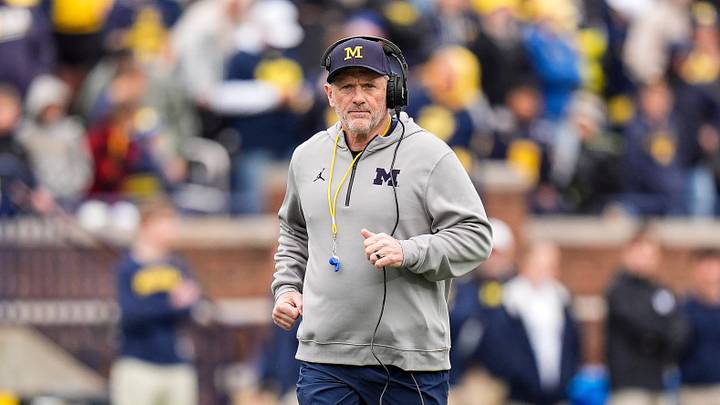 Michigan head coach Kyle Whittingham runs across the field during the spring game at Michigan Stadium in Ann Arbor on Saturday, April 18, 2026.