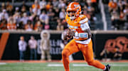 Oct 18, 2025; Stillwater, Oklahoma, USA; Oklahoma State Cowboys quarterback Sam Jackson V (18) runs the ball during the second half against the Cincinnati Bearcats at Boone Pickens Stadium. Mandatory Credit: William Purnell-Imagn Images