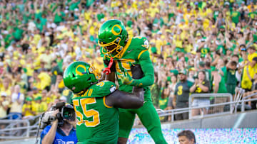 Oregon Ducks offensive lineman Marcus Harper II lifts Oregon Ducks wide receiver Tez Johnson into the air after a touchdown as the Oregon Ducks host the Idaho Vandals Saturday, Aug. 31, 2024 at Autzen Stadium in Eugene, Ore.