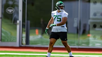 May 27, 2021; Florham Park, NJ, USA; New York Jets offensive lineman Alijah Vera-Tucker (75) participates in a drill during an OTA at Jets Atlantic Health Training Center. Mandatory Credit: John Jones-Imagn Images