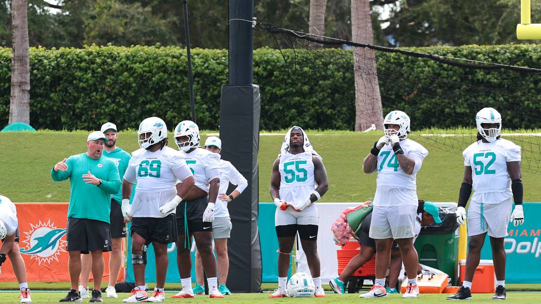 Miami Dolphins offensive line coach Zach Yenser speaks to guard Jamaree Salyer during practice at the Baptist Health Training Complex. Miami Dolphins offensive line coach Zach Yenser speaks to guard Jamaree Salyer during practice at the Baptist Health Training Complex.
